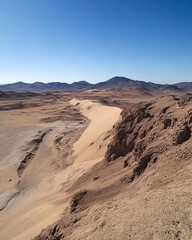 A desert landscape with a mountain in the background