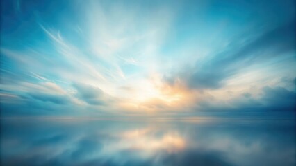Fototapeta premium A blurred portrait of a cloudy sky with soft blue hues and a subtle gradient effect in an abstract studio setting against a plain white wall background , blur, abstract