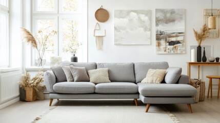 Fototapeta premium A living room with a gray sectional couch and pillows