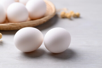 White eggs on white background