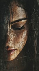 Close up of a woman's face with a textured, dark, and eerie look.