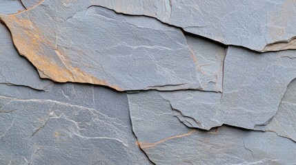 Close-up of layered slate stone with texture and color variations.