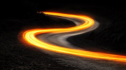 Fiery trail winding through dark landscape at night