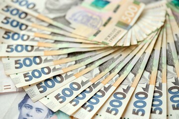 Big amount of different ukrainian hryvnia currency money bills in pile