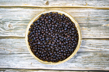 black Coffee  cherries in the basket top view 