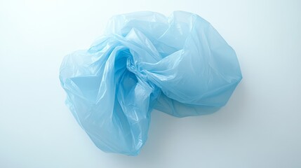 Fototapeta premium 24.A clean, isolated image of a light blue plastic bag on a stark white background, slightly crumpled with natural creases, presenting a simple, modern depiction of everyday plastic waste.