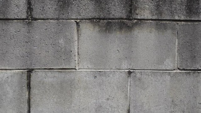 Weathered grey gray concrete block wall abstract textured background