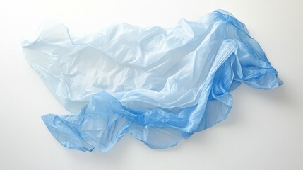Fototapeta premium 21.A wrinkled light blue plastic bag lying flat on a white background, with soft lighting emphasizing the creases and transparency, capturing the simplicity and ubiquity of single-use plastics.