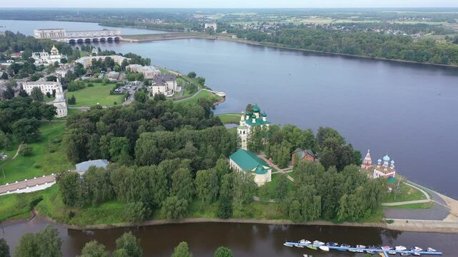 Summer aerial view of modern Uglich cityscape overlooking architectural complex of Kremlin with Transfiguration Cathedral and Church of Dimitry Tsarevich on bank of Volga, Russia
