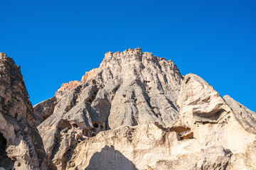 The scenic views of Selime Castle which is the largest and most elaborate cave complex in Cappadocia. The multi-level Byzantine settlement includes a kitchen, halls, church, and rooms in Güzelyurt