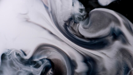 Pigment spill. Grunge flow. Gray black blue paint marble expansion liquid surface. Defocused...