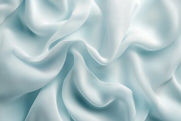 Obraz premium Soft light blue fabric texture, elegant silk waves background.