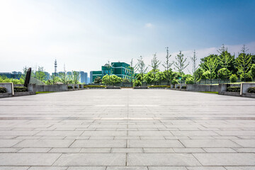 Expansive Urban Plaza with Lush Greenery and Modern Architecture