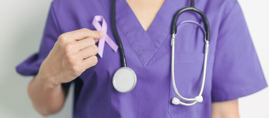 Doctor holding purple Ribbon for Violence, Pancreatic, Esophageal, Testicular cancer, Alzheimer,...