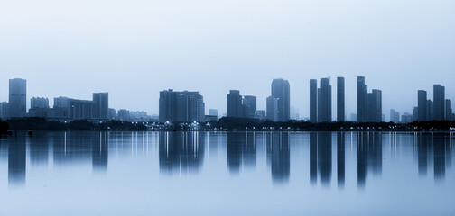 Serene Urban Landscape at Dusk with Reflective Waters