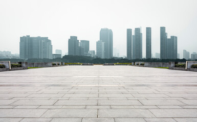 Serene Urban Landscape with Skyline and Empty Plaza in Fog