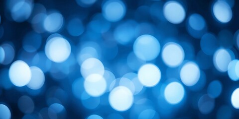 Abstract blue background with soft glowing bokeh lights.