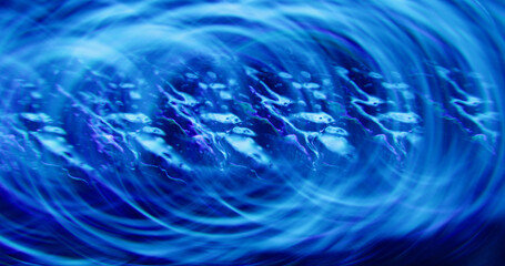Defocused glare. Foam bubbles. Blue sparkling circling flows lens flaring gleaming flickers on art...