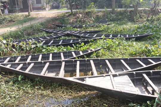 wooden boat on small lake