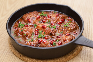 pomegranate chicken in skillet
