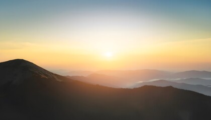 Obraz premium Goal of life, growth and motivation: Bright sunrise over a mountain, symbolizing new beginnings.
