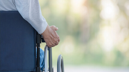 Obraz premium Person in Wheelchair Outdoors 