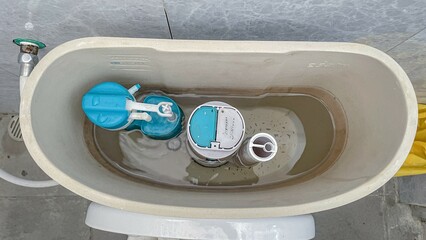 selective focus on the inside of the toilet auto flush tank
