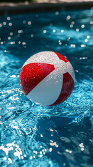 Red and White Beach Ball in Blue Pool Water