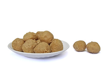 Bakso Sapi, Raw Indonesian Beef Meatballs in a white plate isolated on white background. Made from minced beef and tapioca flour. Food preparation concept.