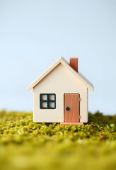 EPC House energy performance certificate - Little cute house made of wooden blocks for property energy rating from A to F, clipart style, with white tones