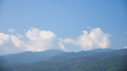 Obraz premium Mountain landscape with blue sky and white clouds. Panoramic view. Chiang Mai - Thailand