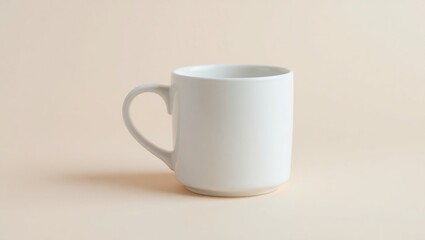 Fototapeta premium A single white ceramic mug sits on a beige background