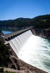 Hydroelectric dam on the river, with white tones