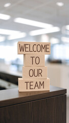 Wooden blocks with words 'Welcome to our team'. Business concept
