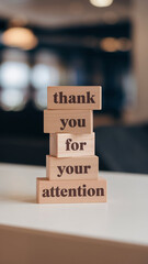 Wooden blocks with words 'Thank You For Your Attention'.
