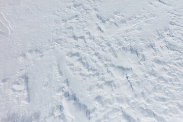 The snow is white and the ground is covered in it