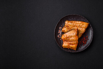 Grilled fish fillet with salt, spices and herbs