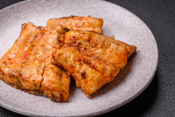 Grilled fish fillet with salt, spices and herbs