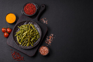 Steamed green beans on a plate with olive oil, sesame seeds