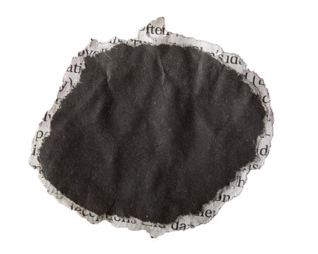 Torn circular black newspaper paper