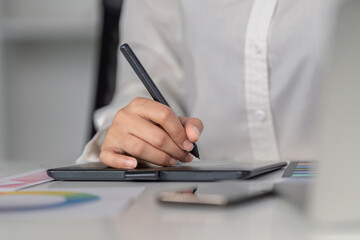 Creative design action of graphic illustration in a professional office environment with digital tools