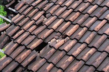 Damaged Roof with Broken Tiles