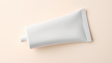 White Tube of Cream on Beige Background