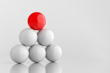 Red sphere standing out from the crowd of white spheres