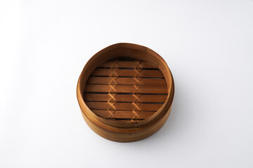 Close-up photo of Wooden dimsum steamer container isolated on white background. Shot on 30 Degree, flat lay angle setup