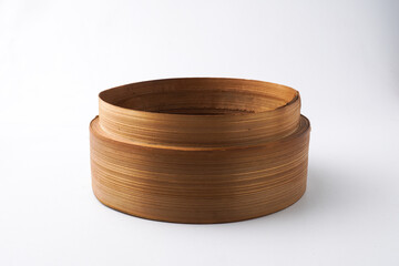 Close-up photo of Wooden dimsum steamer container isolated on white background. Shot on 30 Degree, flat lay angle setup