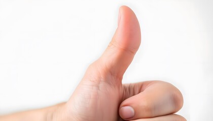 Obraz premium Close-Up of a Person Giving a Thumbs Up Gesture on a Light Background