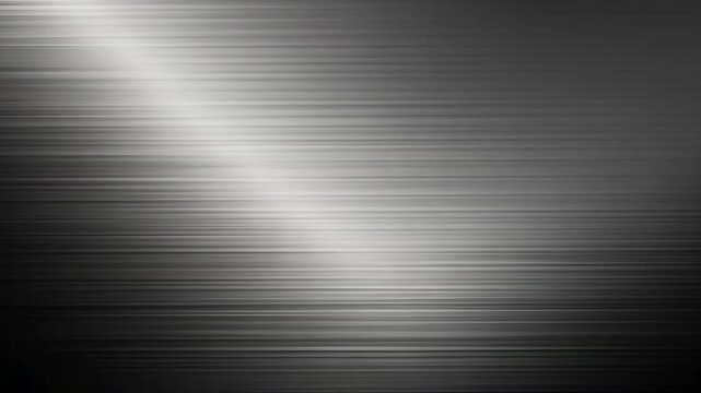 Black and white photo of a metal surface. The surface is very shiny and has a lot of texture