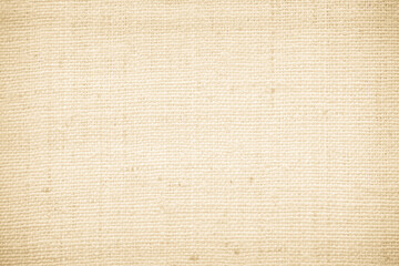 Fototapeta premium Brown sackcloth woven texture background in natural pattern. Jute hessian burlap, linen background in light beige cream color blank. Weaving canvas fiber line cotton cloth textured as organic.