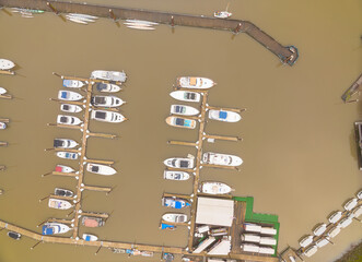 A large body of water with many boats docked at a marina